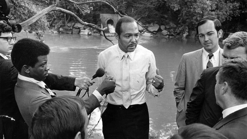 Cleveland mayor Carl Stokes giving a press conference on the banks of the Cuyahoga on June 23, 1969