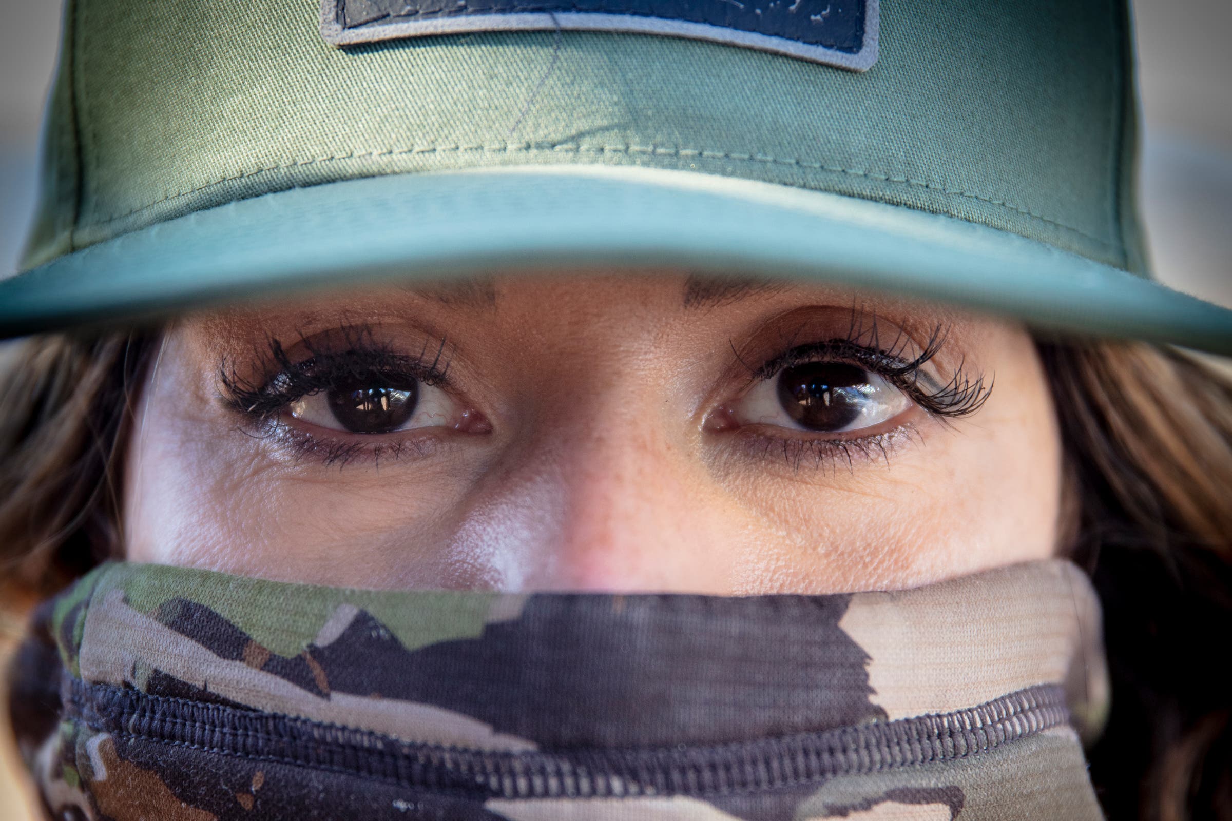 Camo and lashes, Rihana attempts to blend into her surroundings.