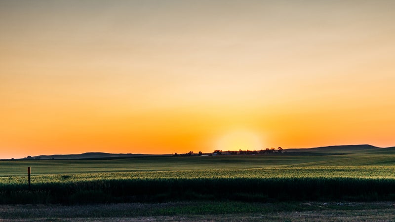 Sunset at an agriculture field in rural North Dakota farm