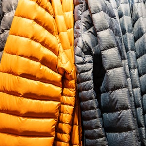 Colorful winter sports jacket on a hanger in the store