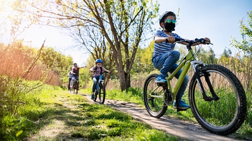 Family enjoying a bike trip during COVID-19 pandemic