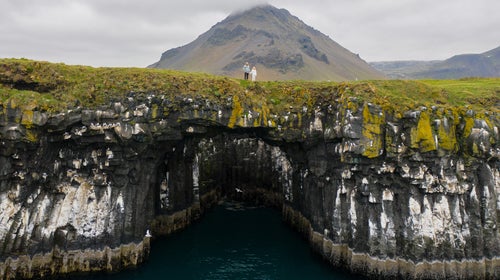 Elli Thor and his daughter, Unnur, atop an oceanside volcanic arch in Iceland. After walking away from kayaking, a newfound passion for surfing and the birth of his daughter gave Elli a new perspective worth living for.