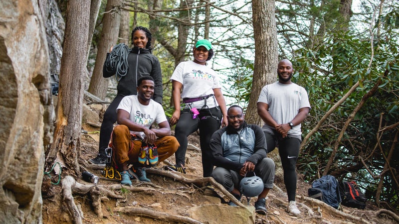 Tyrhee Moore (bottom left) and Soul Trak members during a rock climbing trip in the New River Gorge, West Virginia.