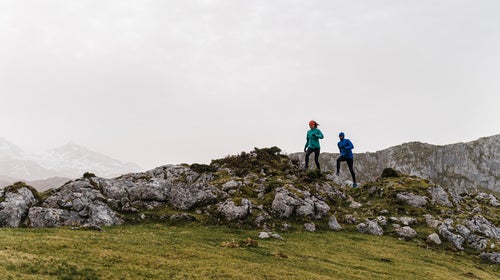 Fit Attractive Woman Running In Nature Close To Partner