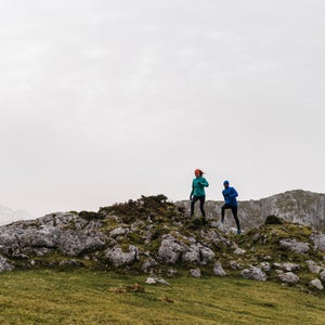 Fit Attractive Woman Running In Nature Close To Partner