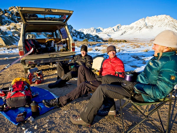 Friends relaxing while car camping