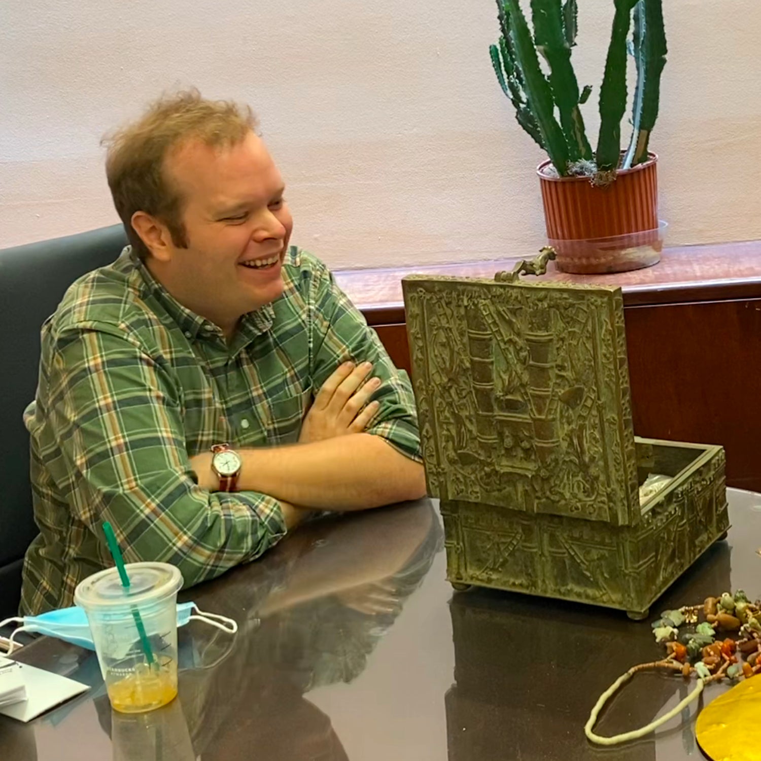 Jack Stuef (left) and Forrest Fenn (right) examining the treasure after its discovery in Wyoming last June