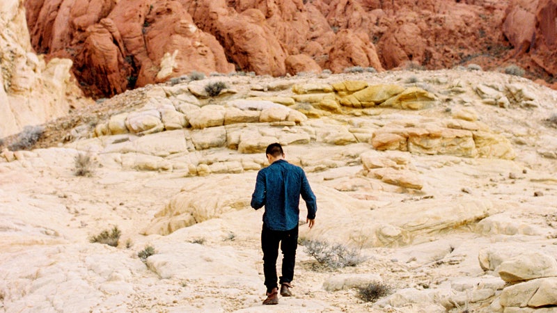 Young Man Walking In Valley Of Fire