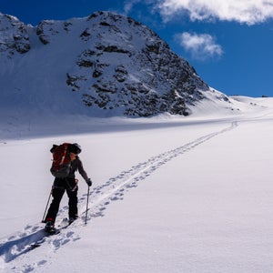Unless you’re planning on boot-packing or snowshoeing up the mountain, you’ll need a splitboard—a snowboard that can be split vertically and used like skis to walk uphill.