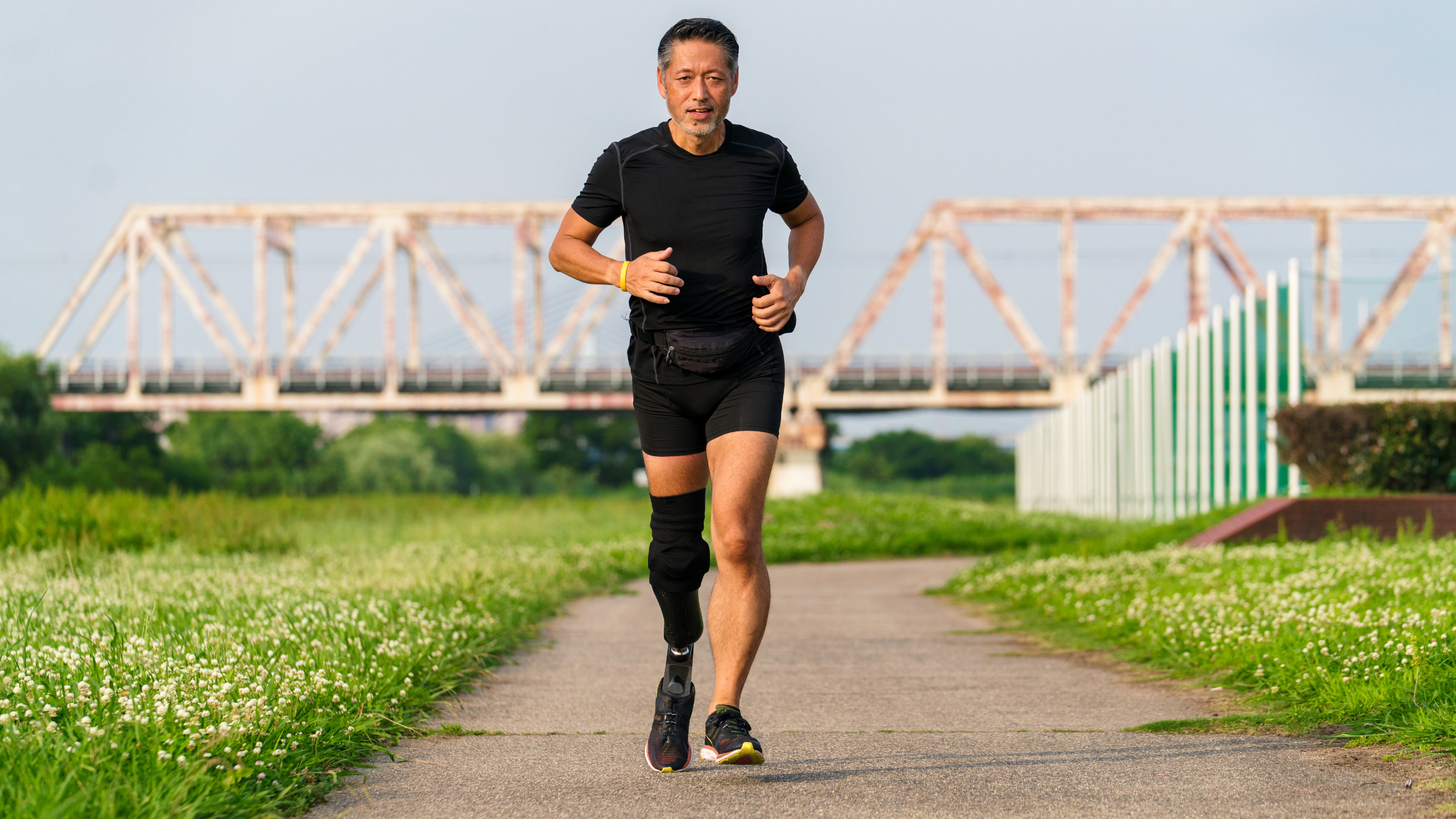 A male runner with a prosthetic leg.