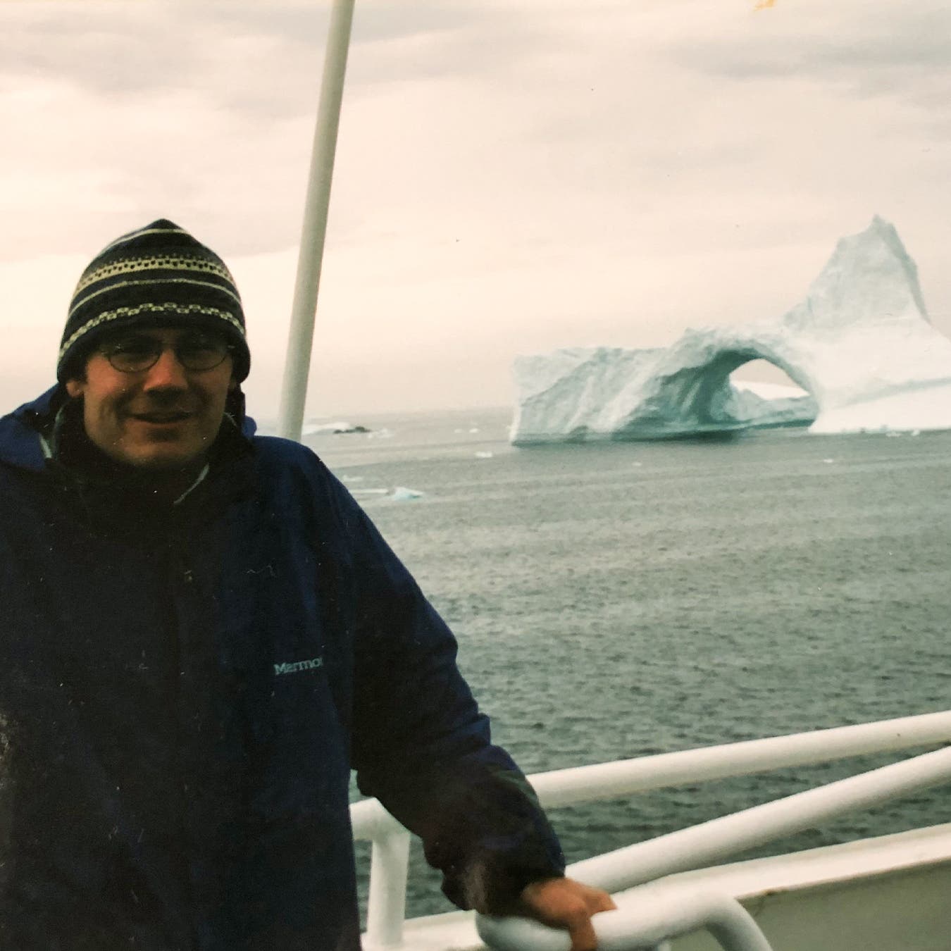 The author during a season spent cruising Arctic regions; this iceberg was between Greenland and Iceland