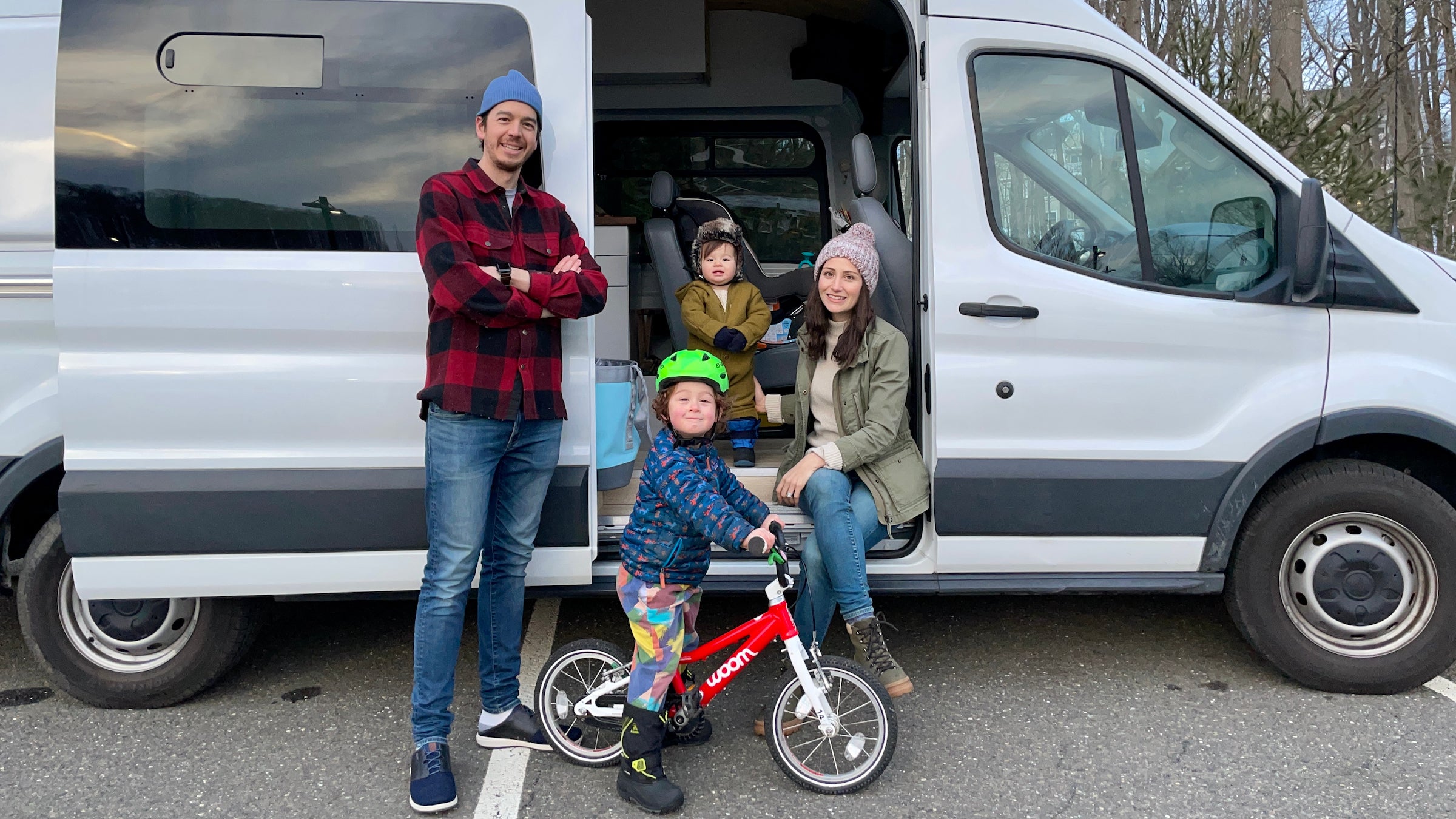 The family in front of their new van