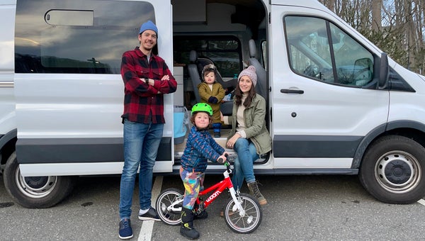 The family in front of their new van