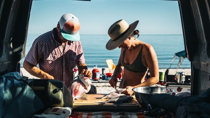 Cleaning fish on the tailgate on the Sea of Cortez