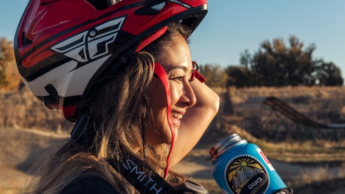 Cross takes a water break while practicing manuals on the dirt jumps at Boise Bike Park.