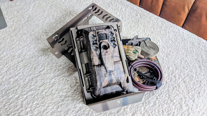 The Moultrie XV6000i in its CamLockBox with accompanying mounting strap and MasterLock Python.