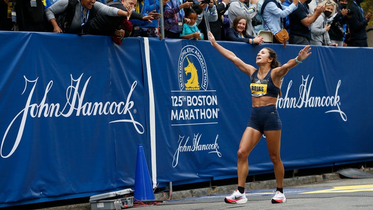 Rojas outstretches her arms to the crowd after crossing the Finish Line of the 125th Boston Marathon in Boston, MA on Oct. 11, 2021. (Photo by Jessica Rinaldi/The )