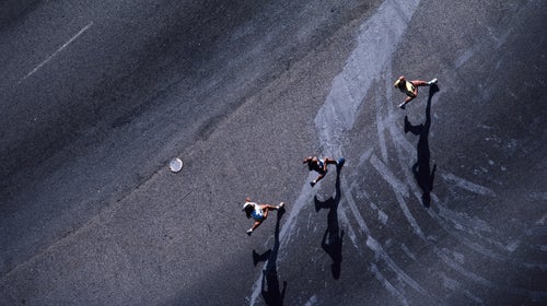 Teenage girls running, overhead view