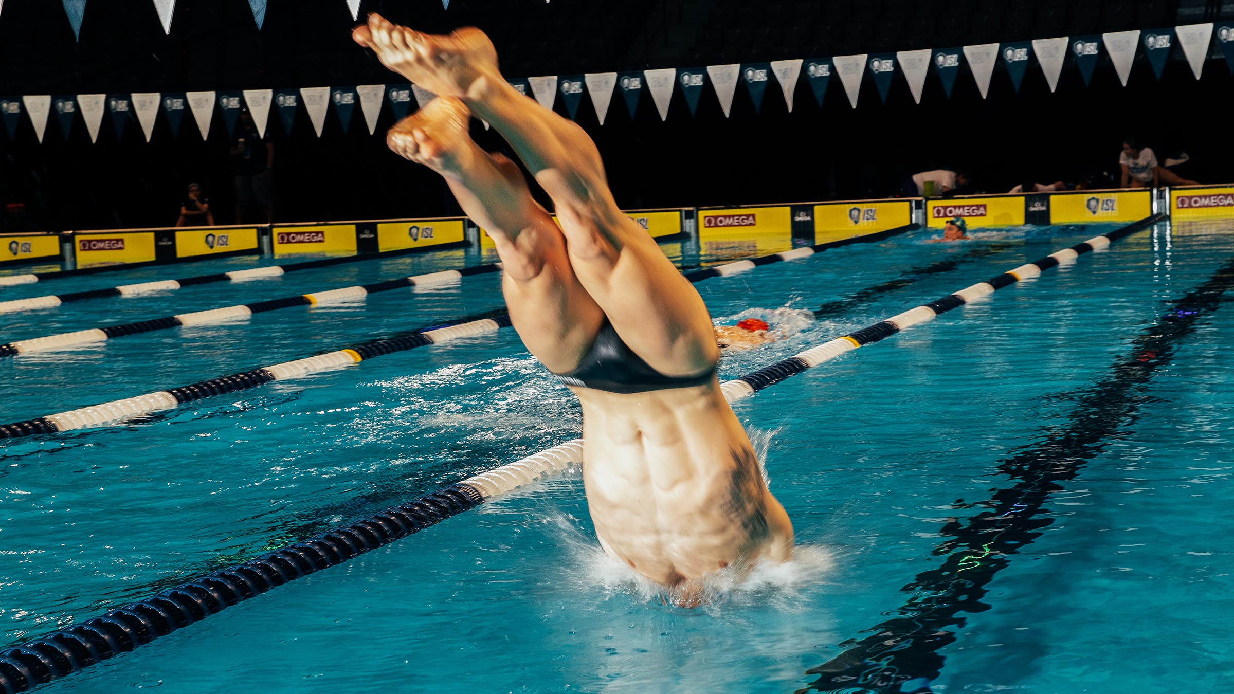 A member of the ISL team Energy Standard diving in