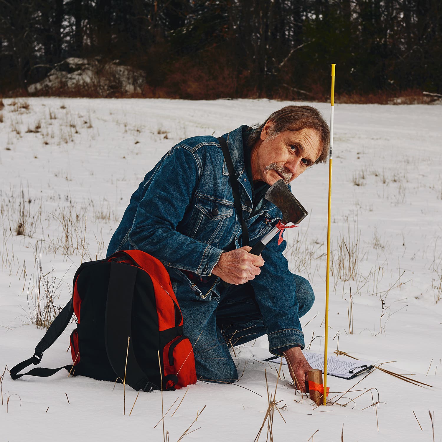 Herbert marking a well site in Vermont
