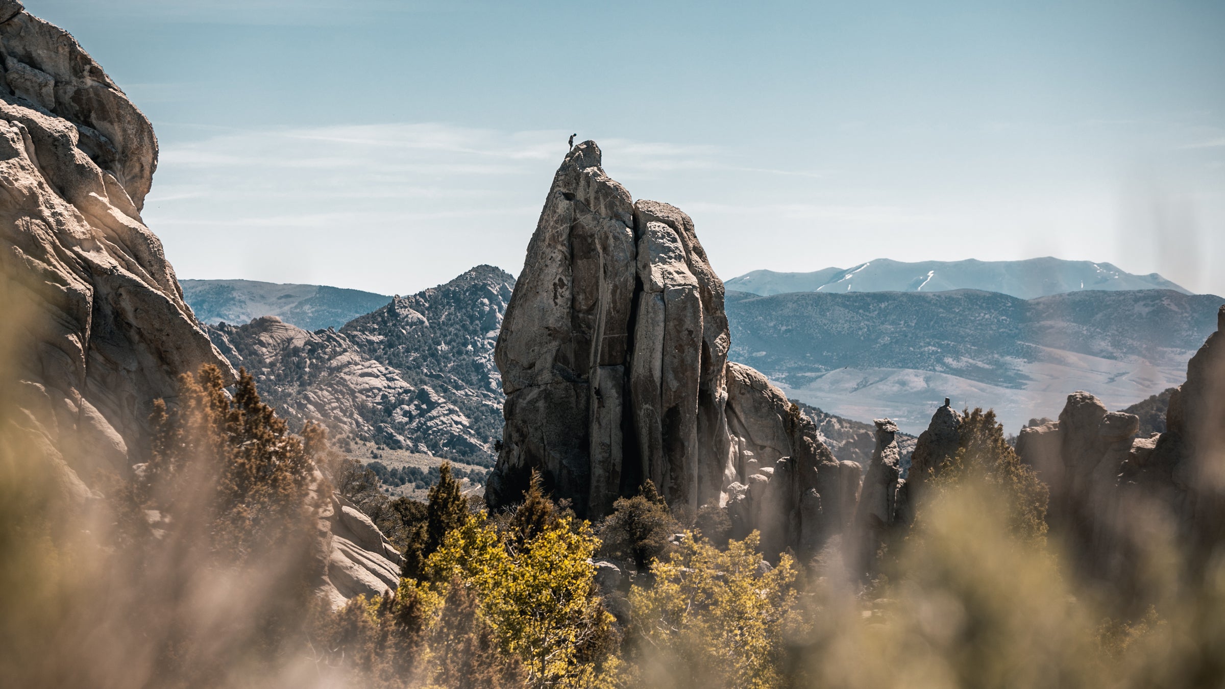Climber On Top Of A Tower