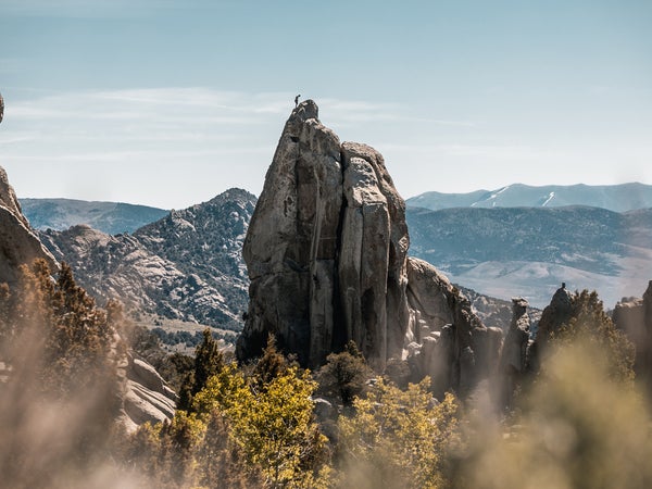 Climber On Top Of A Tower