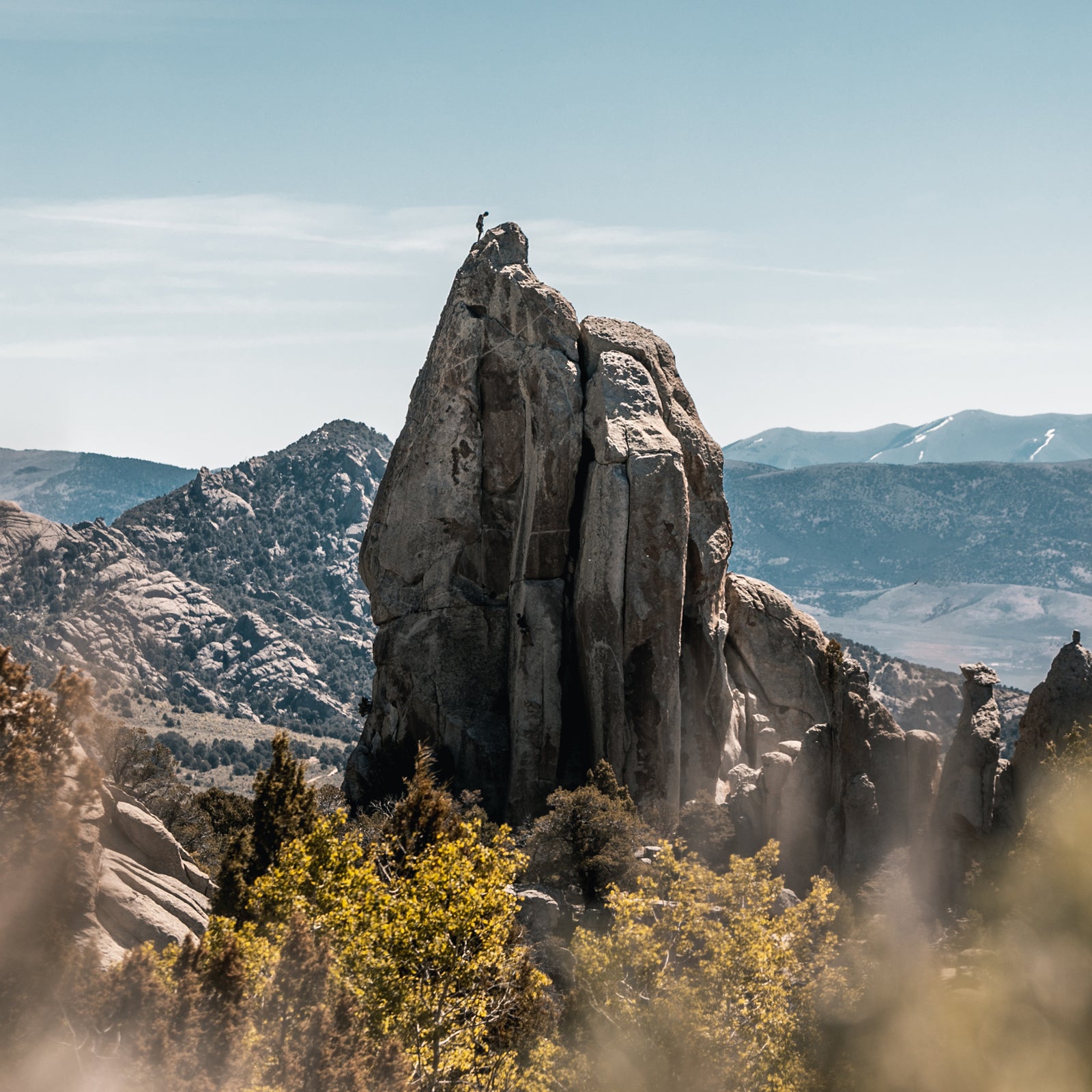 Climber On Top Of A Tower