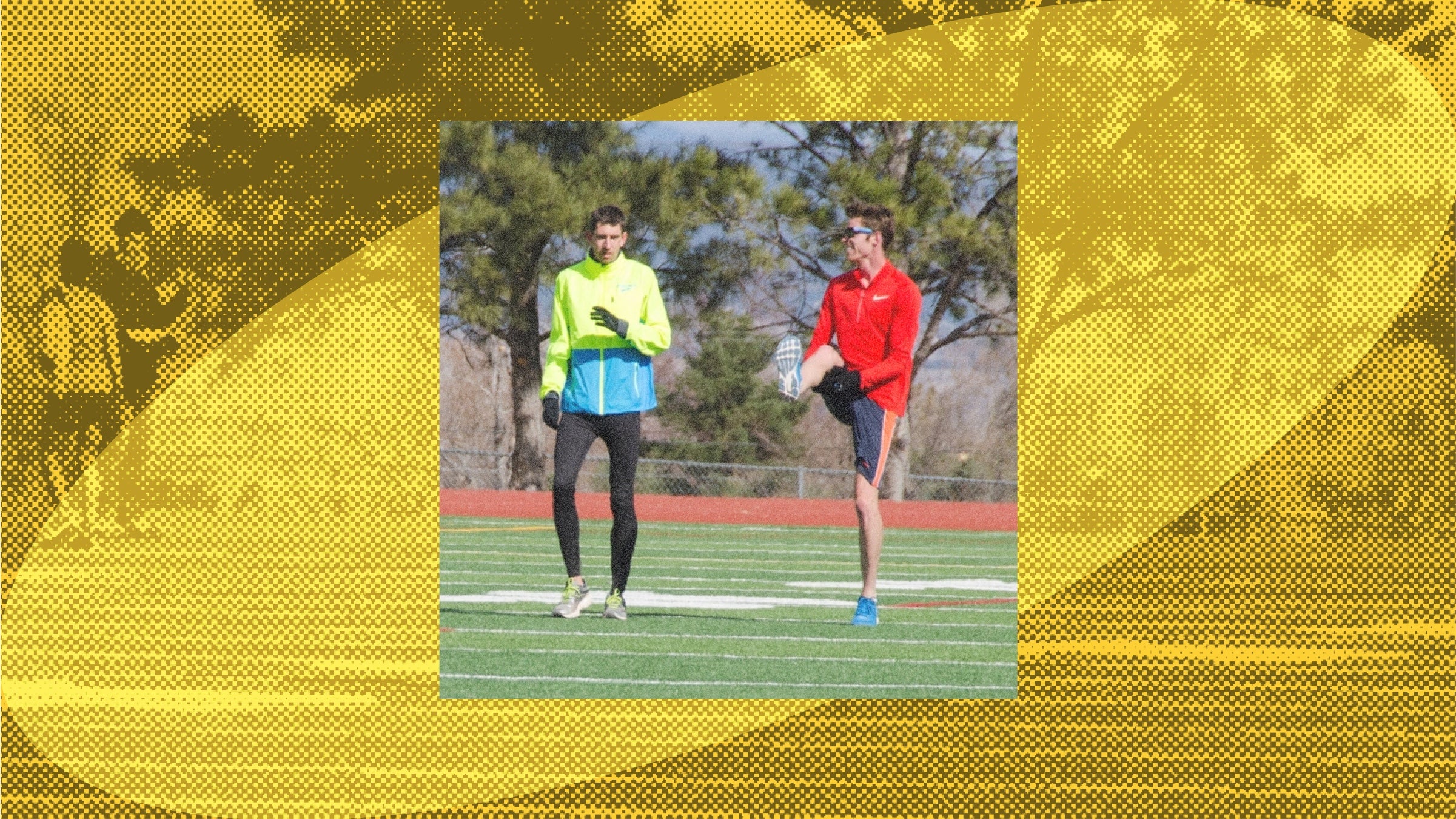 Two professional runners warm up on the grass