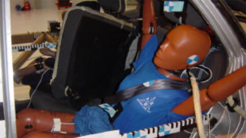 This is the result of a simulated 30 MPH crash with four unrestrained 50 pound suitcases stacked behind the rear seats of a mid-size sedan. You'll note that the seats failed entirely, allowing that luggage to penetrate into the passenger compartment, impacting the rear seat passengers and the front seats.