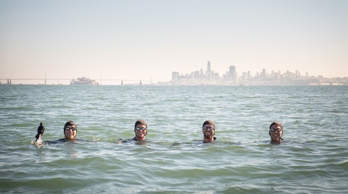 Wilton (second from left) with his three swimming companions, Erik Osterholm, Kenny D'Evelyn, and Brandt Miller, roughly midway between Sausalito and Belvedere, California
