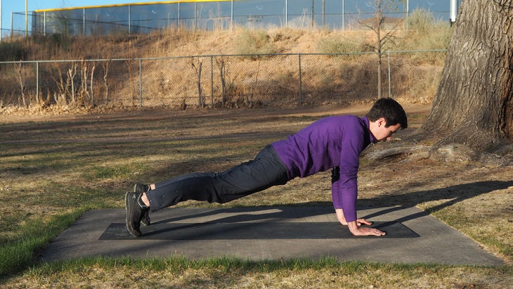 man in high plank