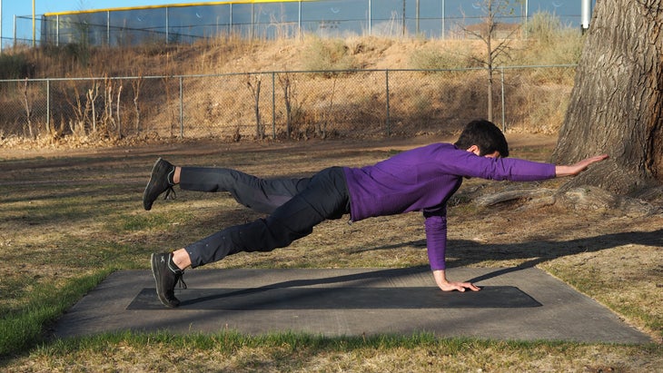 man extending right arm and leg out again