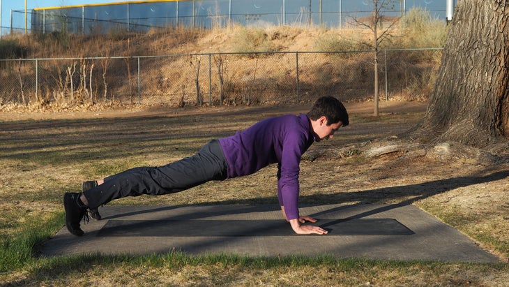 man in high plank