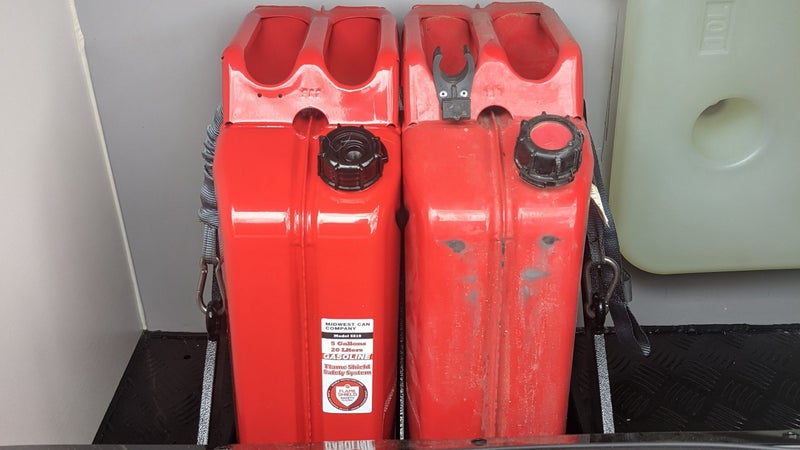 These are the two Harbor Freight Jerry cans I keep mounted inside a special, ventilated fuel storage cabinet on the outside of my new Black Series HQ12 camper.
