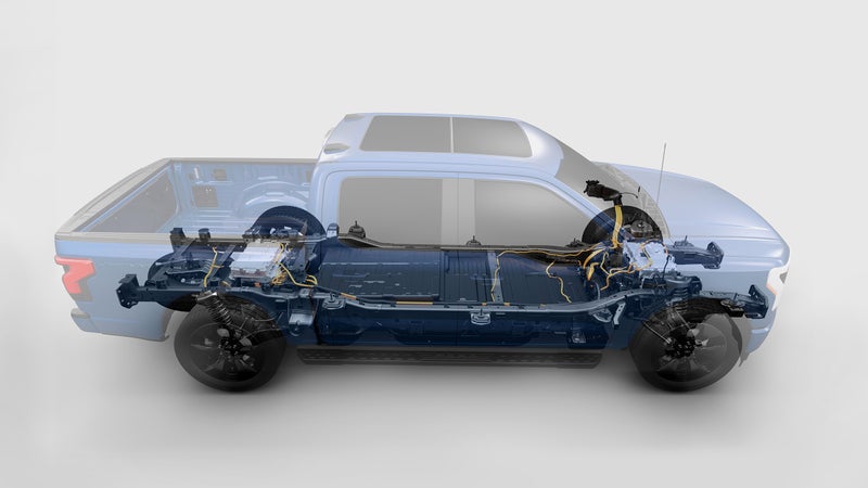 This cutaway illustration shows the mechanical layout of the Lightning鈥檚 chassis. One electric motor is located centrally on each axle. The large battery pack, which weighs 1,800 pounds on its own, fits in the space between the axles and frame rails.