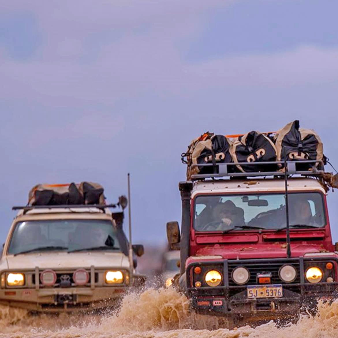 I’m pretty sure that’s me, driving the red Toyota Hilux, somewhere north of Mount Dare, Australia.