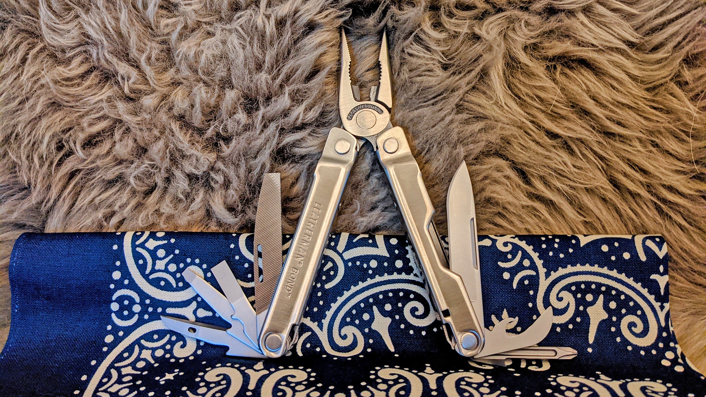 The Leatherman Bond contains: Needlenose pliers, regular pliers, hard-wire cutters, wire cutters, wire stripper, a 420HC blade, an awl, a ruler (4 in; 10cm), can opener, bottle opener, wood/metal file, Phillips screwdriver, medium screwdriver, small screwdriver. 
