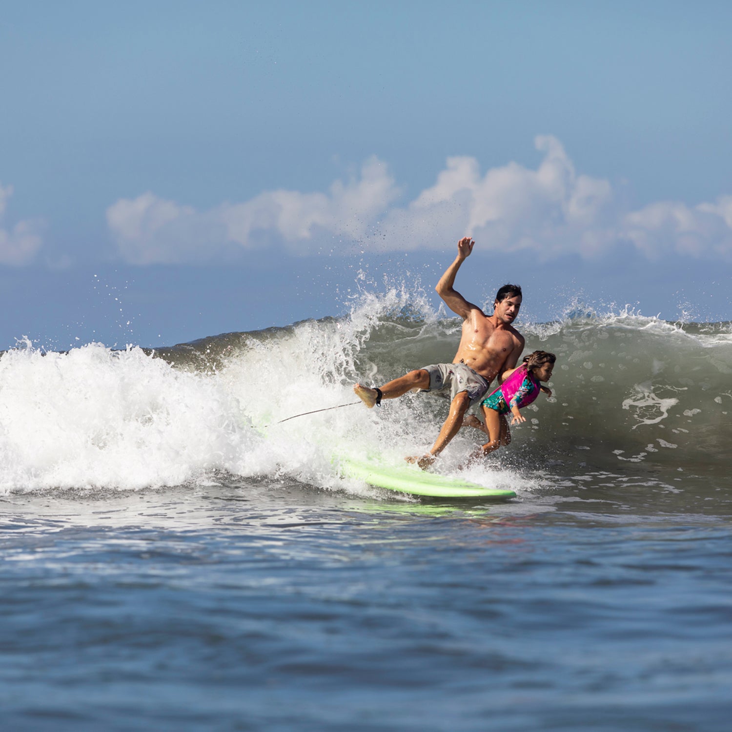Father And Daughter Surfers Falling In Waves