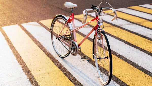 Vithage Woman's Pink Bicycle Standing On The Road