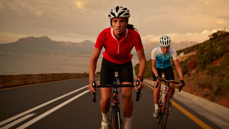 Bike rider accelerating from training partner