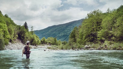 Slovenia, man fly fishing in Soca river