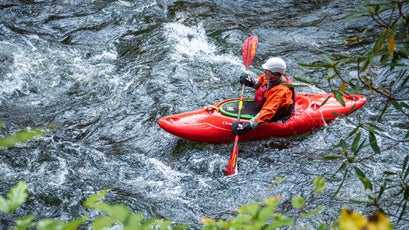 Kayaker navigating the Nantahala River in Natahala Gorge near Bryson City, North Carolina. (USA)