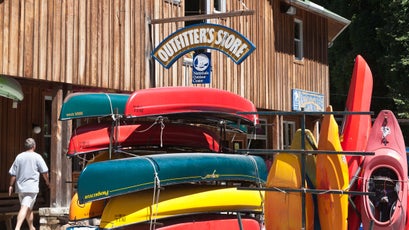 Canoes and kayaks stored outside the Outfitter's Store at the Nantahala Outdoor Center in North Carolina