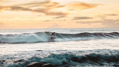 A Surfer Catching A Wave In Nicaragua