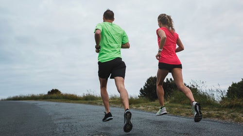 Motivated Young Couple Running Together ԹϺ On Cold, Windy Day