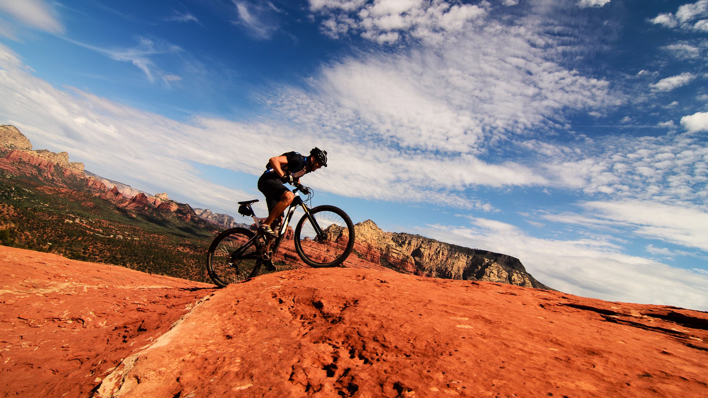 Mountain biker riding uphill in desert