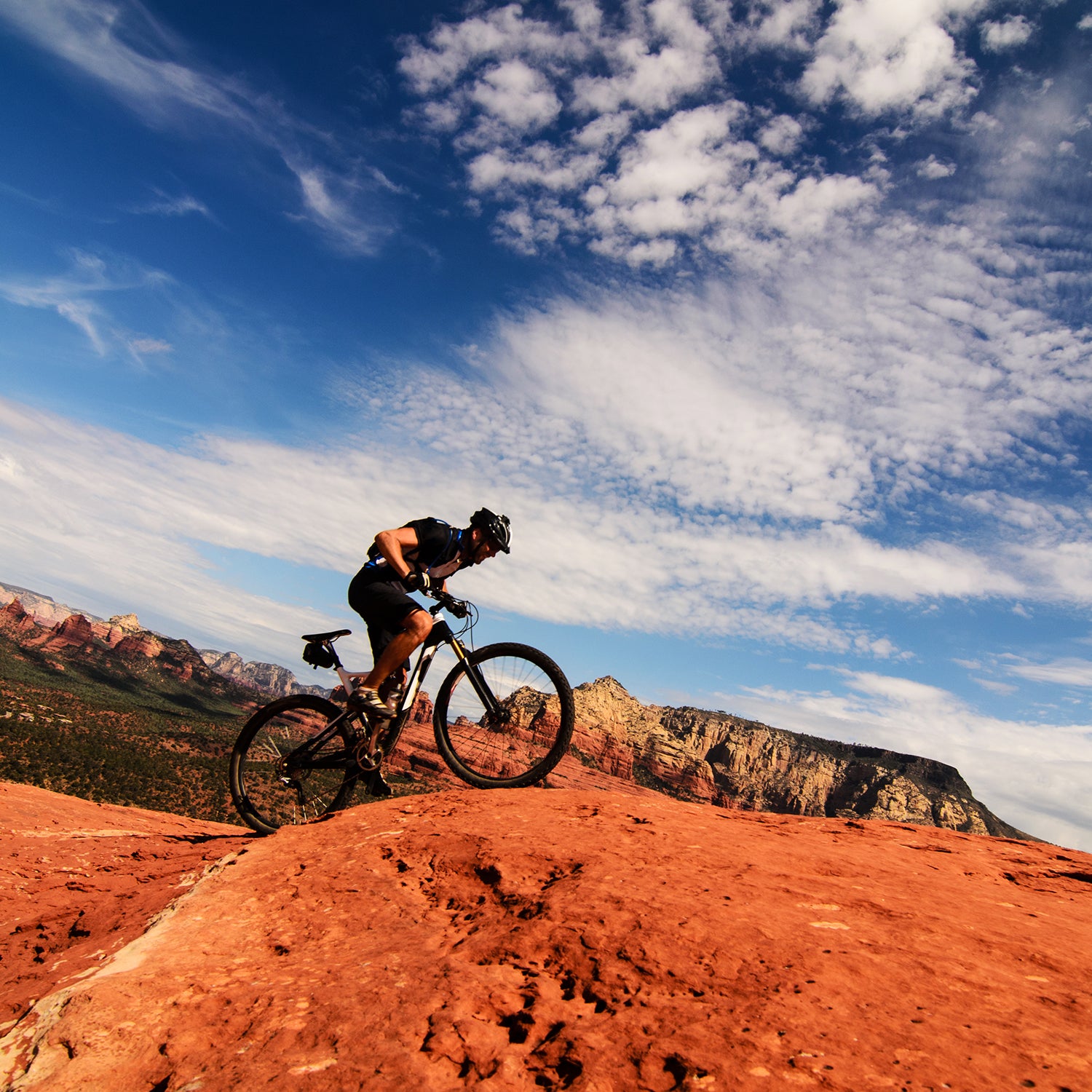 Mountain biker riding uphill in desert