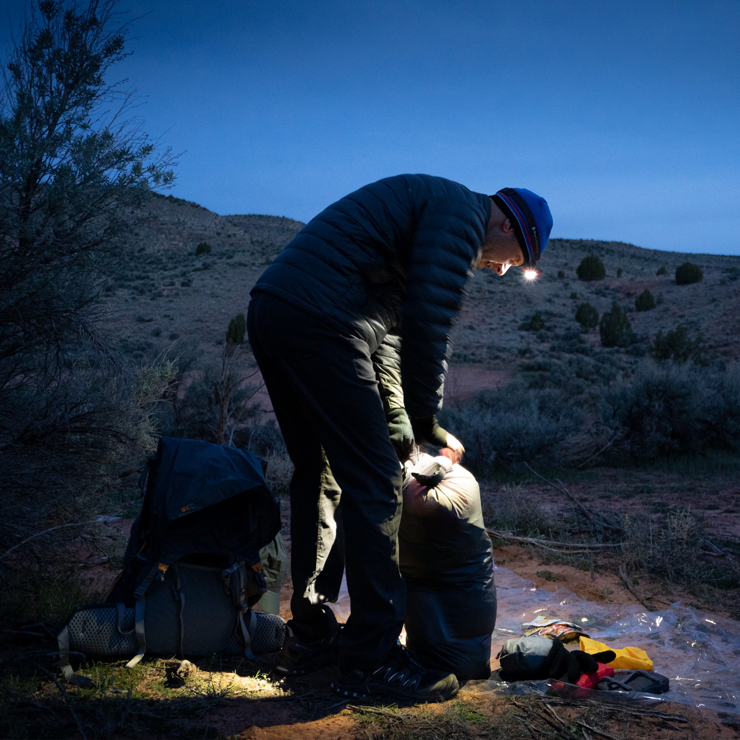 Ali Selim, the author, breaks camp in pre-dawn light before heading into Buckskin Canyon.
