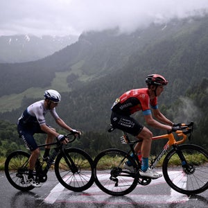 Michael Woods (left) climbs during the 8th stage of the 2021 Tour de France.