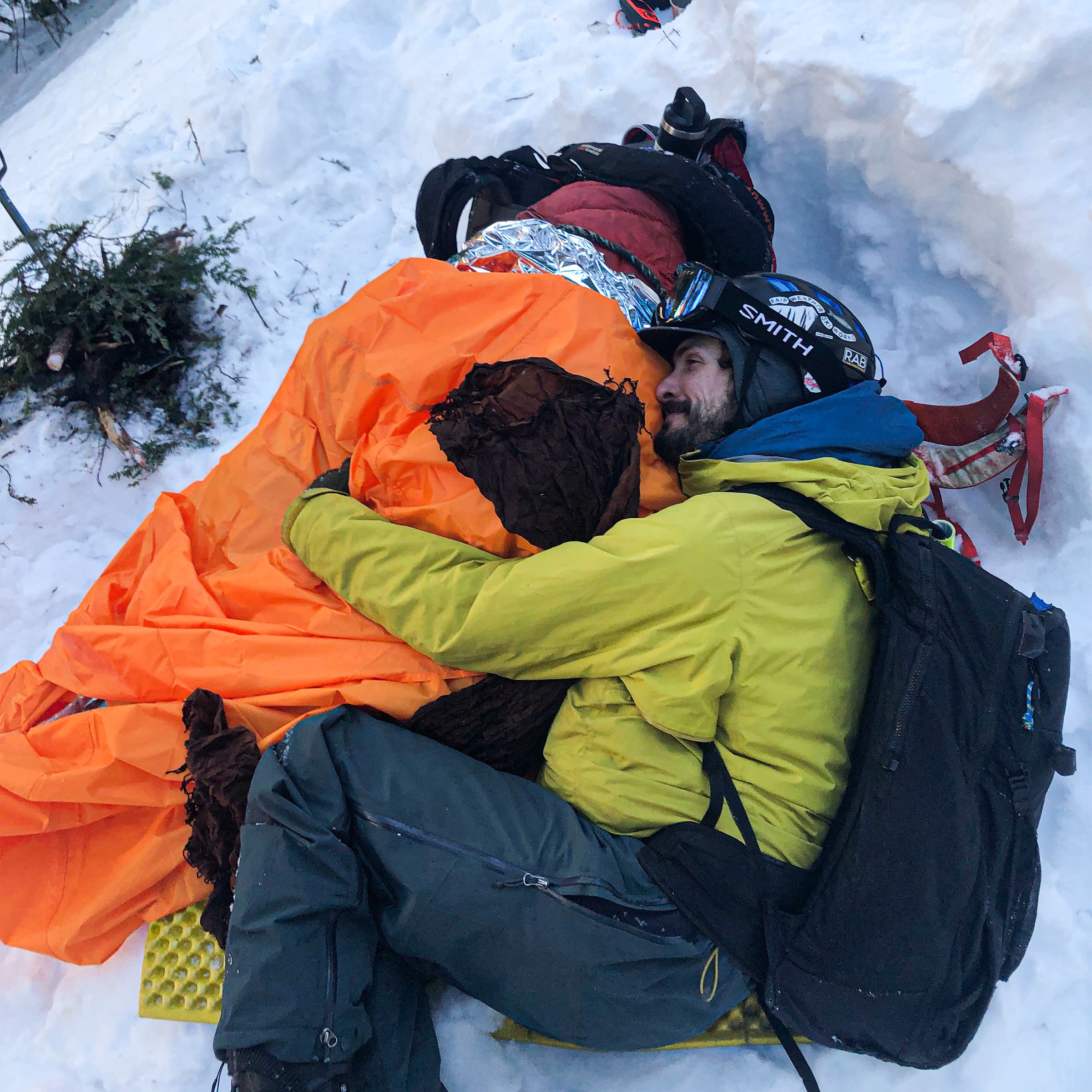 Moskowitz keeping Pieciul warm at the rescue scene after the attack